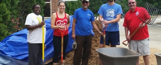 Rockwell Automation volunteers help prep playgrounds